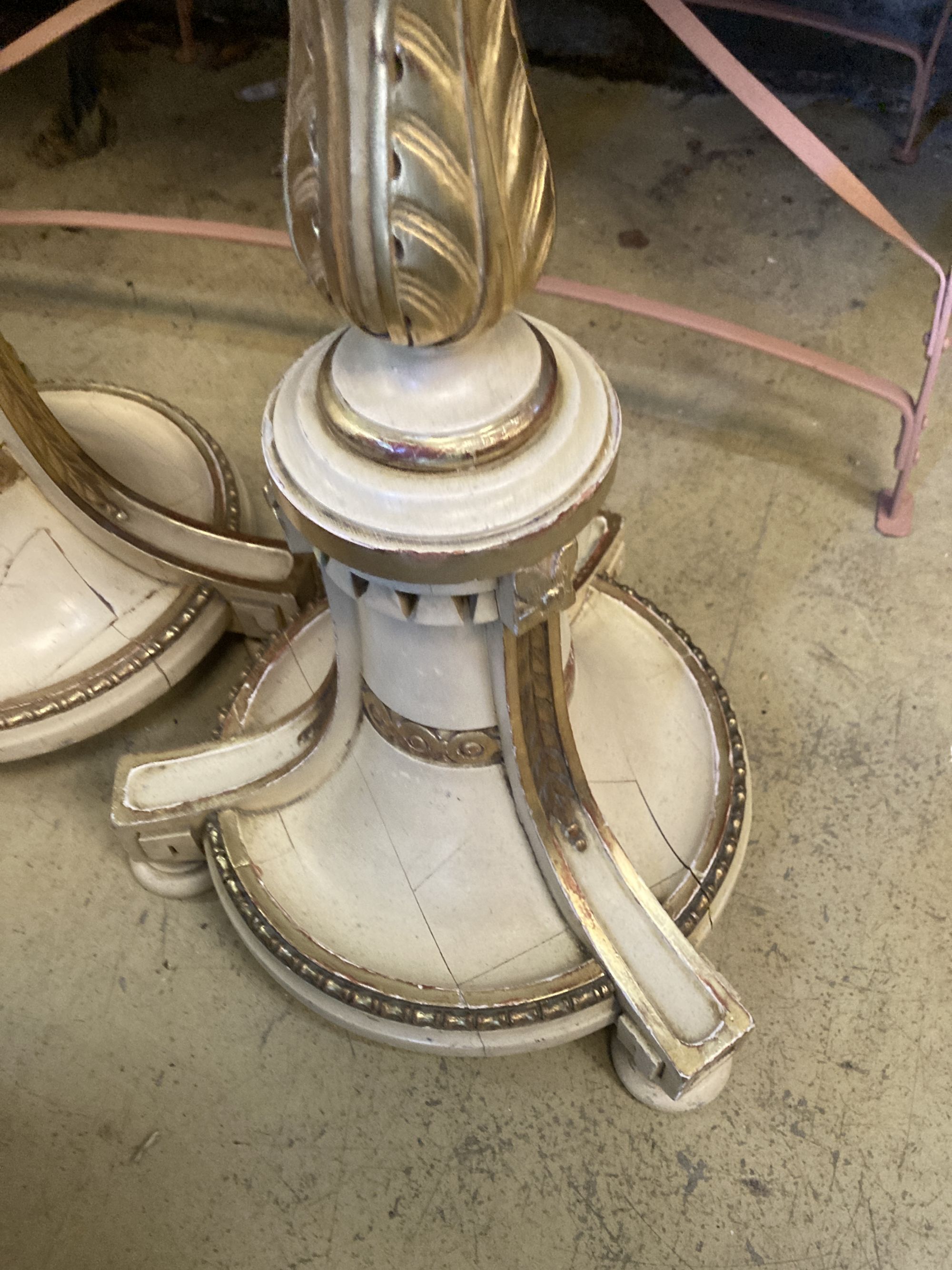 A pair of cream painted parcel gilt standard lamps, height 166cm